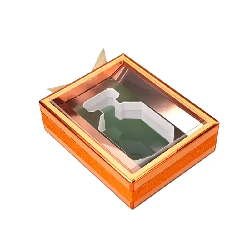 Orange rigid perfume gift box with transparent clear window lid custom white foam die cut insert glitter gold ribbon detail empty cosmetic packaging box isolated on white background